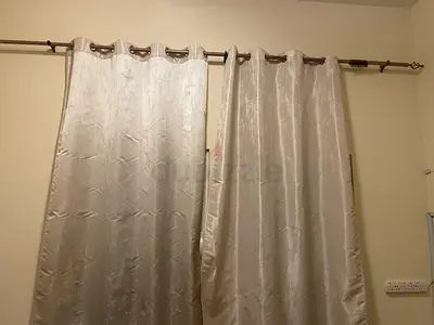 Pair of ivory eyelet curtains, light-blocking fabric, ready to hang with curtain rod
