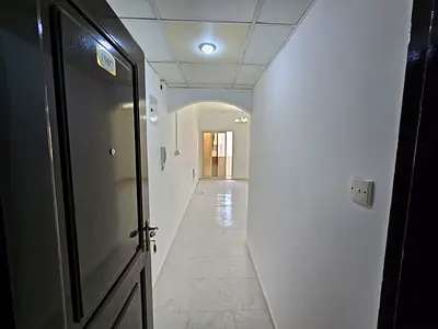 2-bedroom apartment with free gym and pool in a prime and lively location, close to cafes, malls, pharmacies, shops, and near Dubai exit.