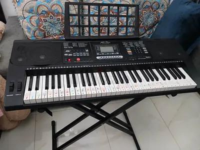 Electronic Keyboard with LCD Screen - its metal stand and few Piano practice books