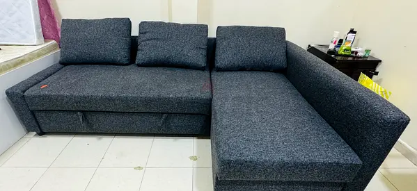 Dark Grey L-Shaped Sofa with bed Storage — Good Condition