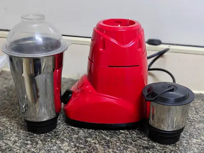 Used red mixer grinder with 2 jars - good working condition