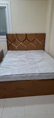 Queen size bed frame with upholstered headboard and base - good condition