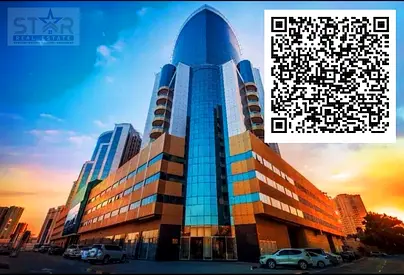 A bedroom and a living room in Al Orient Towers with private parking, your opportunity for freehold ownership in Ajman