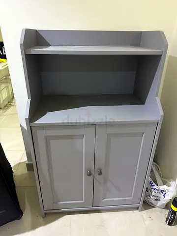Compact Grey Kitchen/Storage Cabinet with Shelves and Doors