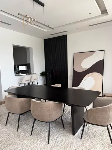Modern black dining table with chairs
