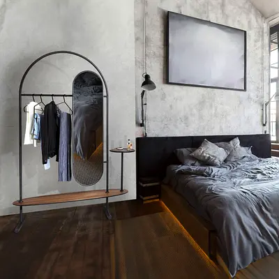 Minimalist arched clothes rack with mirror and shelf - black metal