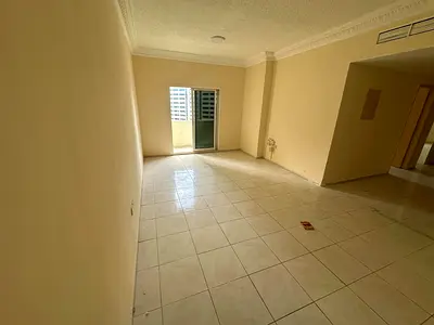 2BR apartment in Al Majaz 2 near lake & park. Central AC, 2 baths, parking, balcony with open view. Prime location, annual rent.