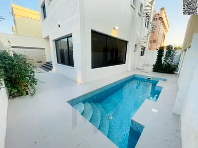 Al Rawda villa, near Sheikh Ammar Street, large area, freehold ownership, includes electricity, water and air conditioning