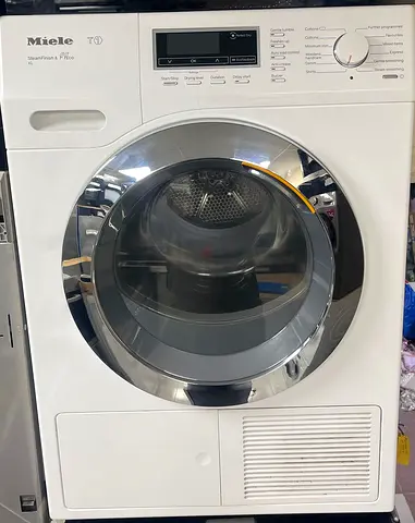 Miele T1 Heat-Pump Tumble Dryer, identified by its prominent chrome door and distinctive control pan