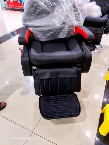 Used Black and Red Hydraulic Barber/Salon Chair with Footrest