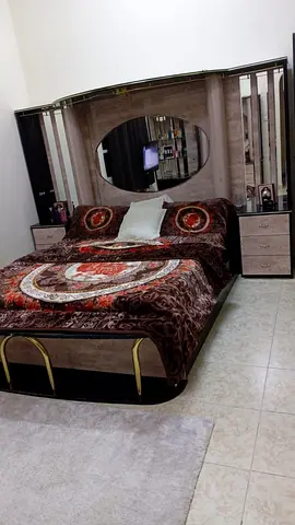 Queen Bed with Mirrored Headboard and Attached Nightstands