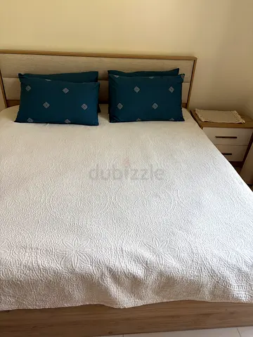 King size wooden bed frame with headboard and mattress