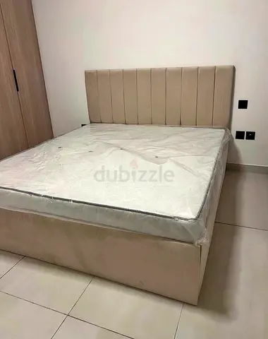 Beige Upholstered Double Bed with Headboard and Storage Base