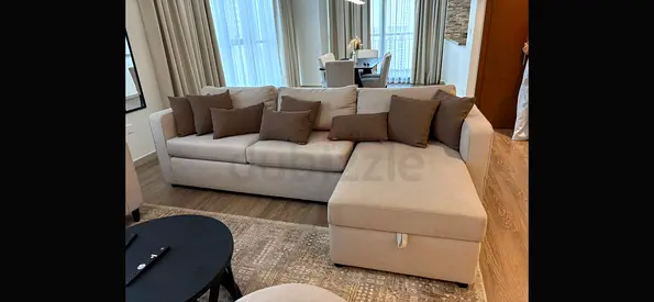 Light beige L-shaped fabric sofa with chaise - like new condition