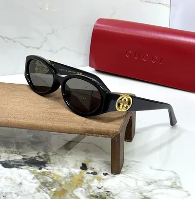 Gucci Black Round Frame Sunglasses with Gold Logo