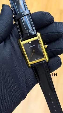 Cartier-style rectangular gold-tone wristwatch with black leather strap