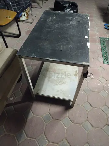 Used small metal table with storage shelf — sturdy utility side table