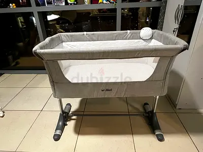 Bassinet with mosquito net and battery operated music system for sale