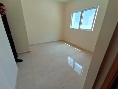 Luxury one-bedroom apartment for rent in Al Majaz 3, featuring two bathrooms, built-in wardrobes, c