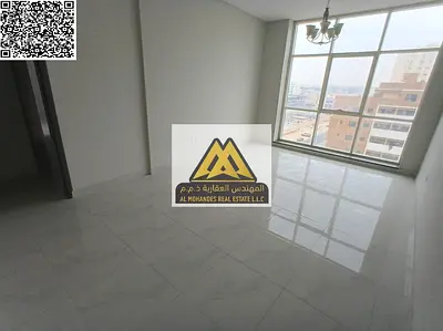 A 2-bedroom apartment with a living room for annual rent in Al Jurf 3 – Ajman, located in a new bui