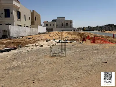 For sale: Prime residential land plot, including registration fees, corner lot in Al Helio 1, Ajman