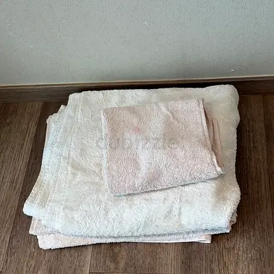 Collection of towels, bath mats and kitchen towels