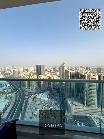 عرض مميز! أقل دفعة أولى، شقة بإطلالة مفتوحة بالكامل، غرفتين نوم وصالة - جاهزة للسكن | طابق مرتفع | مع موقف سيارات | برج الواحة