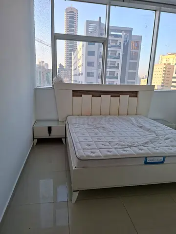 King bed frame with mattress and bedside tables - good condition