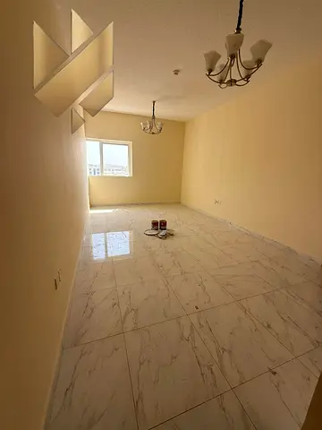 Two-bedroom apartment with a living room for annual rent in Muwailih Al Jadeeda. Spacious and with excellent finishes.