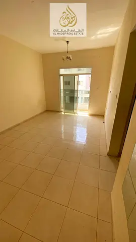 Two bedrooms, a large living room with a balcony, two bathrooms, and a master bedroom, located on King Faisal Street.