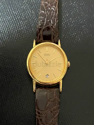 Classic Seiko Gold Tone Analog Wristwatch with Brown Leather Strap