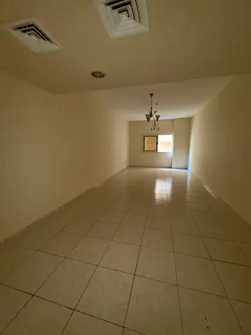 The most elegant and beautiful two-bedroom apartment in Al Majaz 3, Sharjah, near Al Majaz Park. It features four bathrooms, a maid's room with a mast