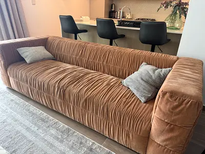 Long three-seater corduroy-style sofa in tan/brown, good condition