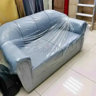 Two-seater grey leather sofa Brand New