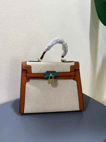Small Beige Canvas Top-Handle Bag with Brown Leather Trim and Gold Lock
