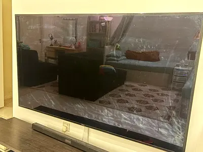 75 Samsung LED TV with soundbar - used, screen has surface marks
