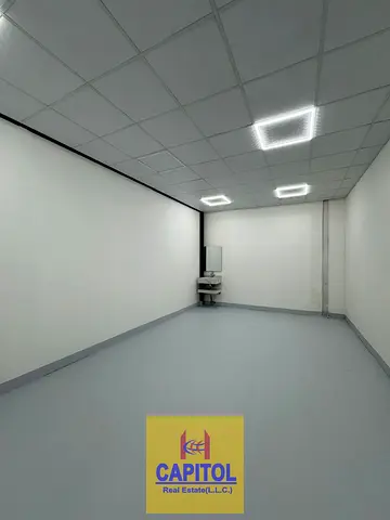 Premium storage space designed for organized inventory management with a washbasin and easy loading and unloading access in Al Quoz 1