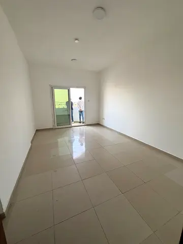 2-bedroom family apartment with balcony and central AC on Al Wahda Street. All nationalities welcome