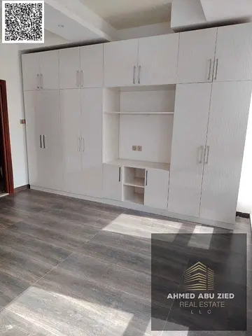 Stylish 1BR apartment, hall, 2 baths, wardrobes, central AC, deluxe finish, prime location, easy access to Dubai & Sharjah