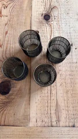 4 black and bronze candle holders Crate and Barrel