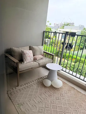 Small outdoor 2-seater sofa with cushions + side table and beige rug — good condition. Full set