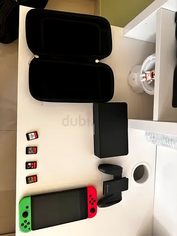 Nintendo Switch OLED Bundle – 4 Games + Case + Dock + Joy-Con Grip | Ready to Play