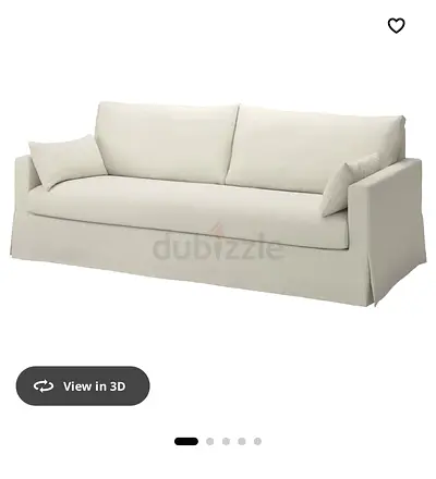 Three-seater slipcovered sofa in light beige — good condition