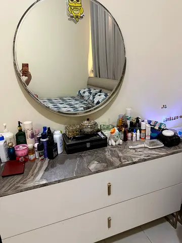 White dresser with marble top and round mirror - good condition