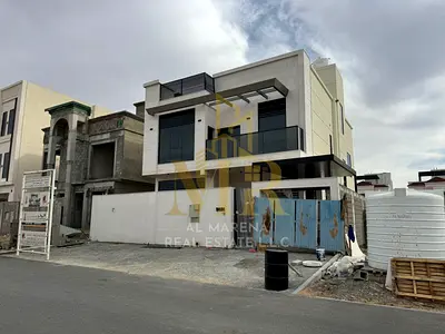 Two-story villa with a rooftop terrace, at a special price including registration and ownership fees, in one of Ajman's most prestigious areas. Freeho