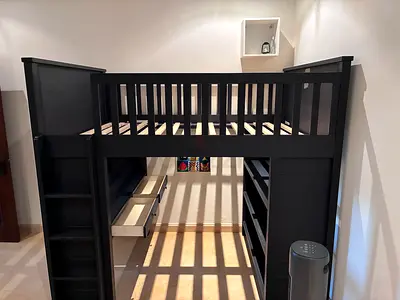 Pottery Barn loft style bed with storage shelving and drawers. No mattress.