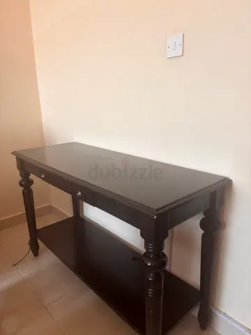 Dark wooden console table with turned legs - good condition