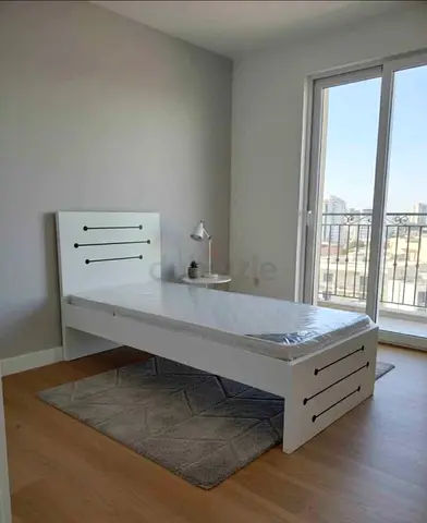 Single white wooden bed frame with mattress - modern simple design