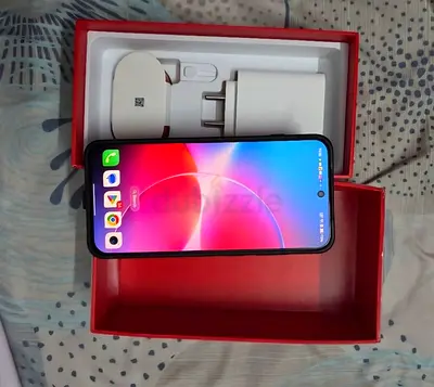 OnePlus smartphone with box and charger - good working condition