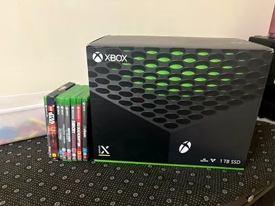 Xbox series x with 2 controllers and 6 games